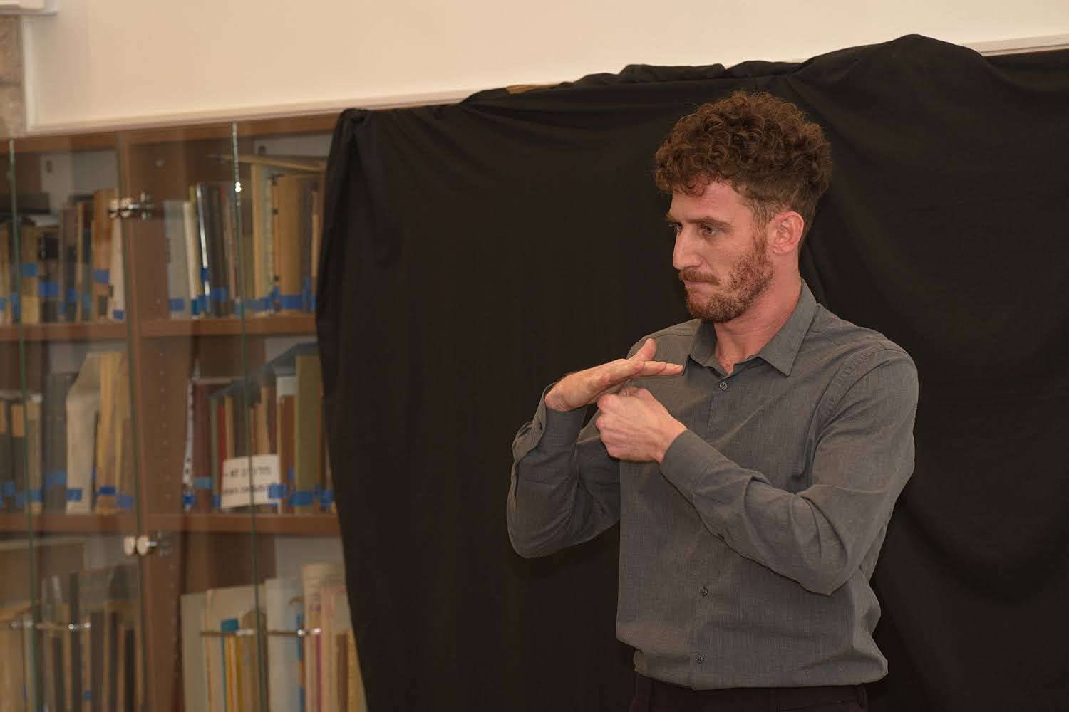 Closeup of a person’s hands as they teach Israeli Sign Language to a class